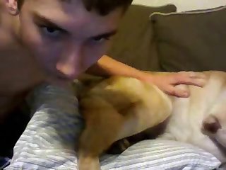 Boy And Dog On Teh Couch